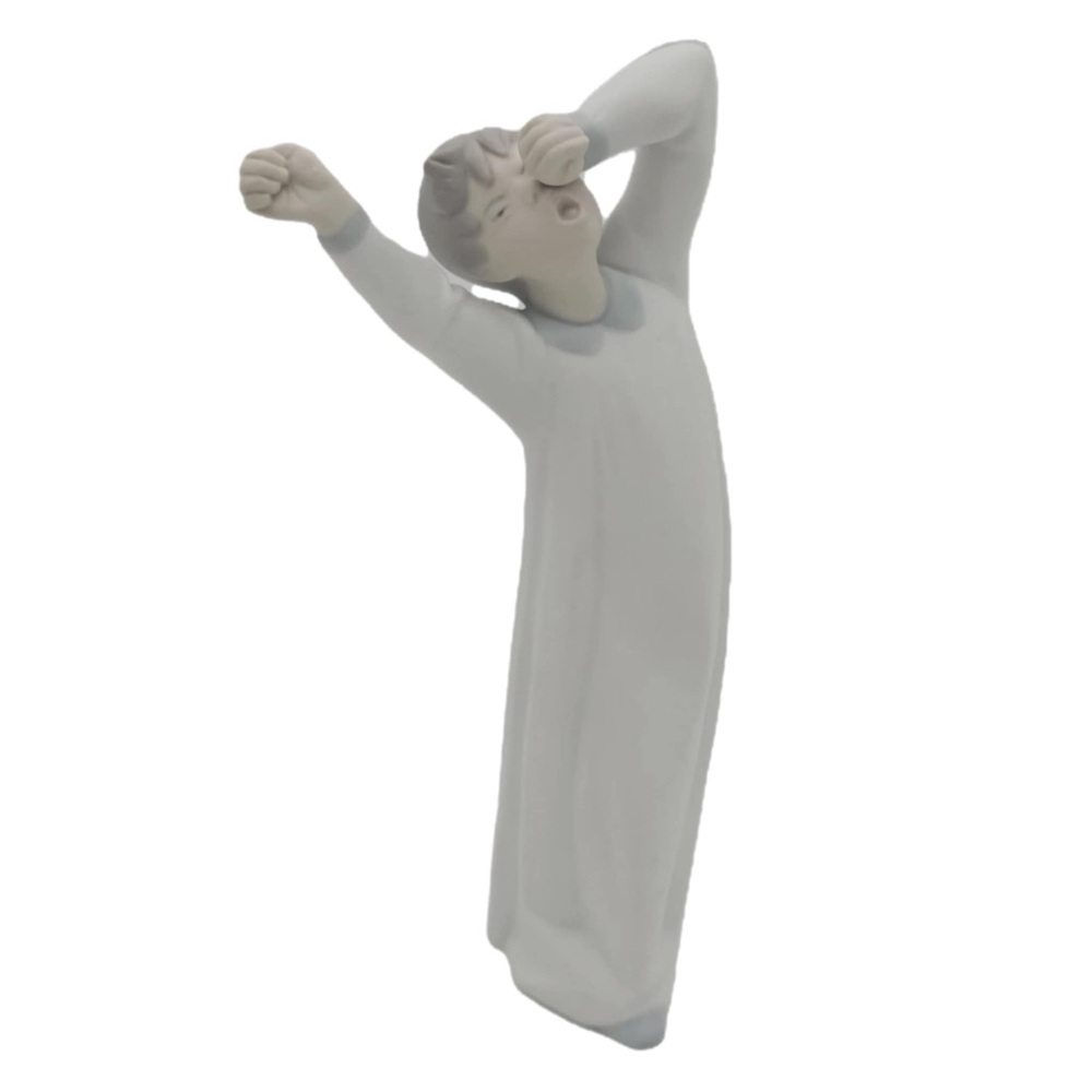Lladro “Boy Yawning” Matte Figure